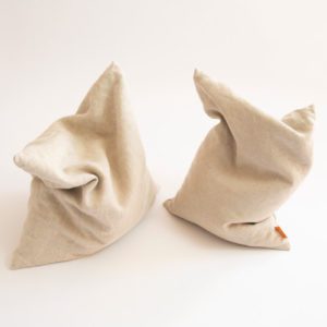 two husk pillows shaped in a funny way